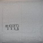 witte handdoek "De Hoofdzaak"
